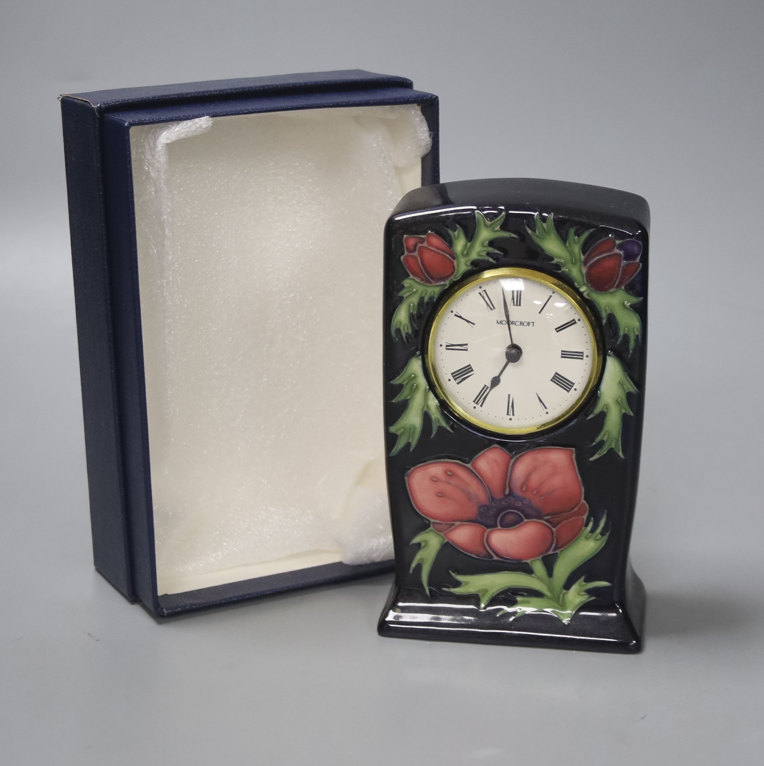 A Moorcroft pottery Anemone pattern quartz clock